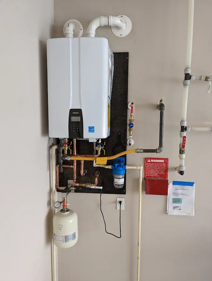 Professional plumber installing copper piping in a Firebaugh home